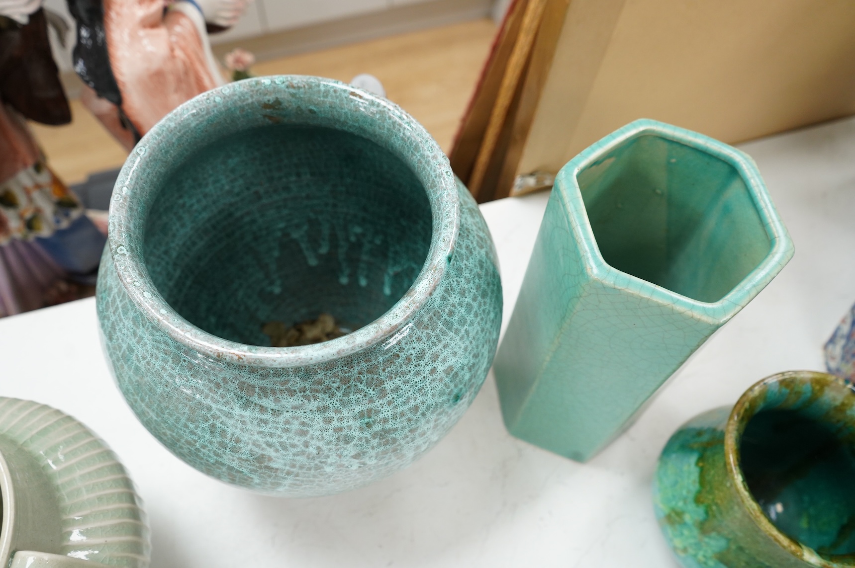 A group of Continental green glazed earthenware vessels including a crystal glazed jug, largest 29cm high